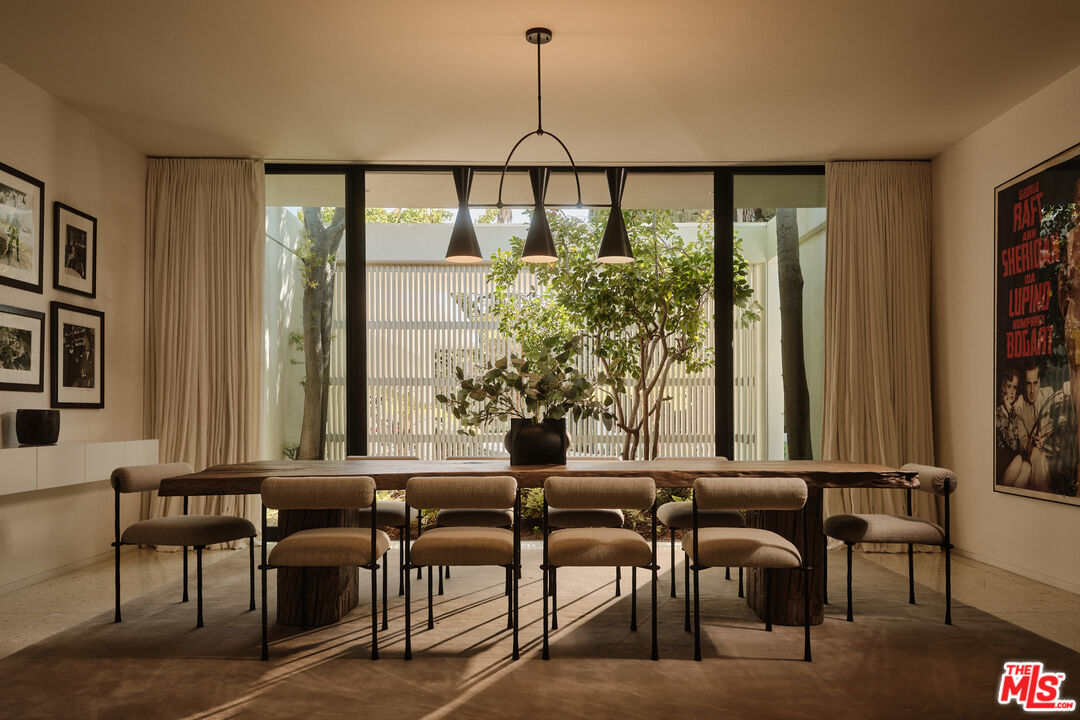 713 North Hillcrest Road Beverly Hills, CA 90210 - Photo 8 of 28 a view of a dining room with furniture and window