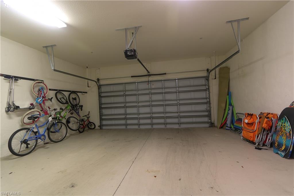 9114 Capistrano Street South, Unit 8501 Naples, FL 34113 - Photo 12 of 26 a view of a garage with furniture