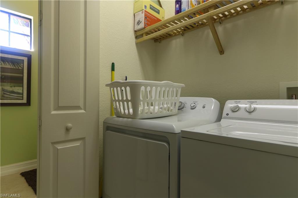 9114 Capistrano Street South, Unit 8501 Naples, FL 34113 - Photo 13 of 26 a utility room with dryer and washer