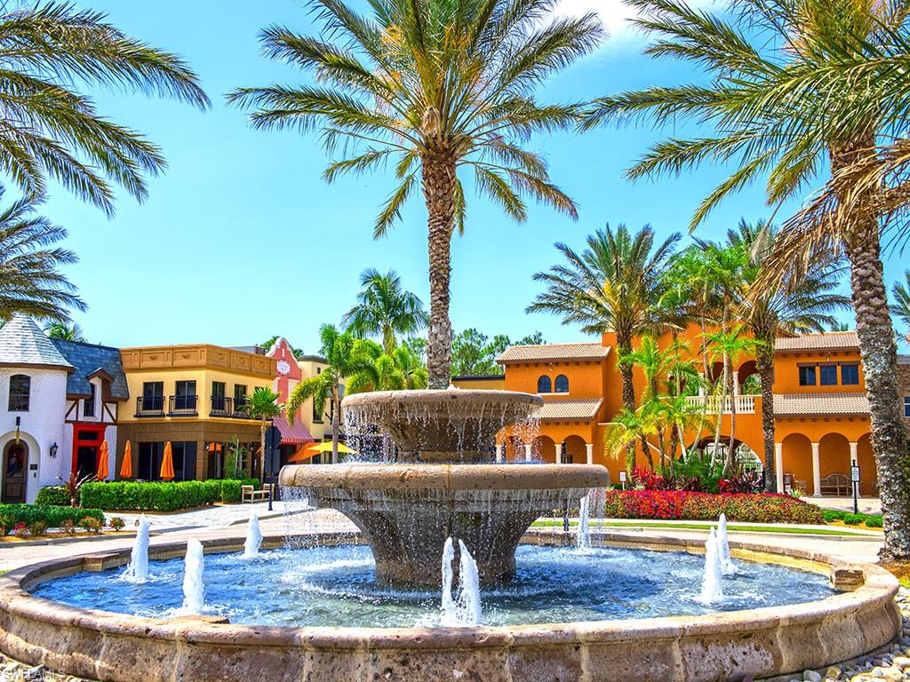 9114 Capistrano Street South, Unit 8501 Naples, FL 34113 - Photo 16 of 26 a view of multiple houses with a yard