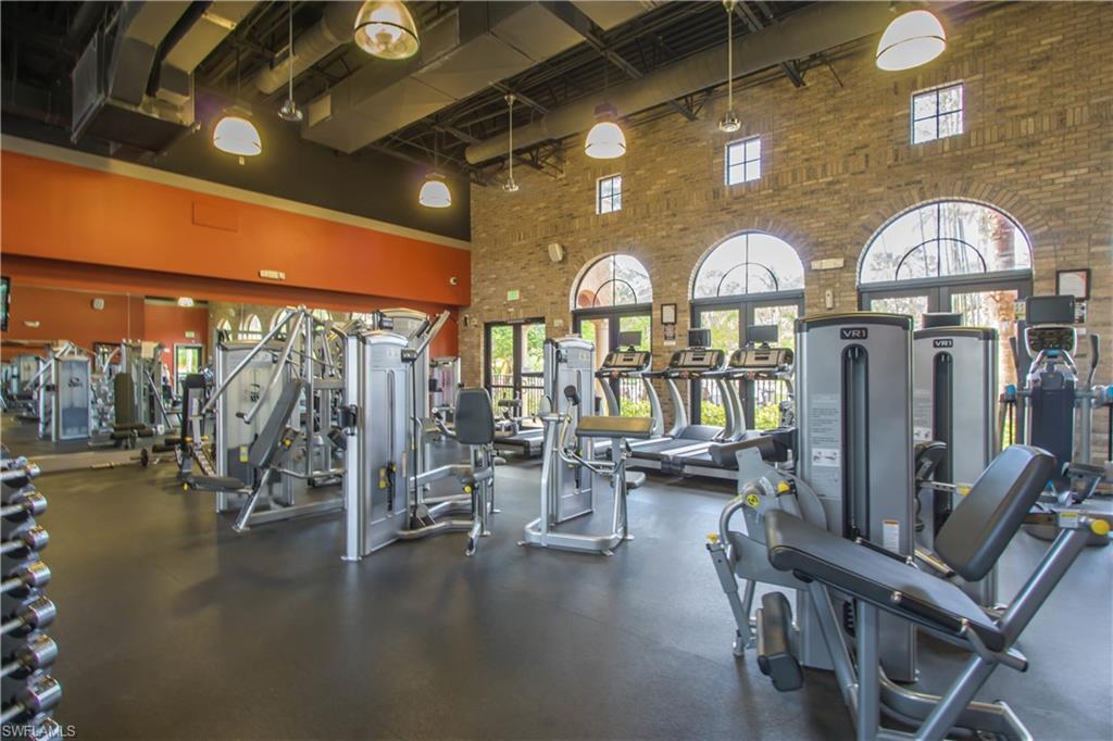9114 Capistrano Street South, Unit 8501 Naples, FL 34113 - Photo 20 of 26 a view of a livingroom with furniture and a gym