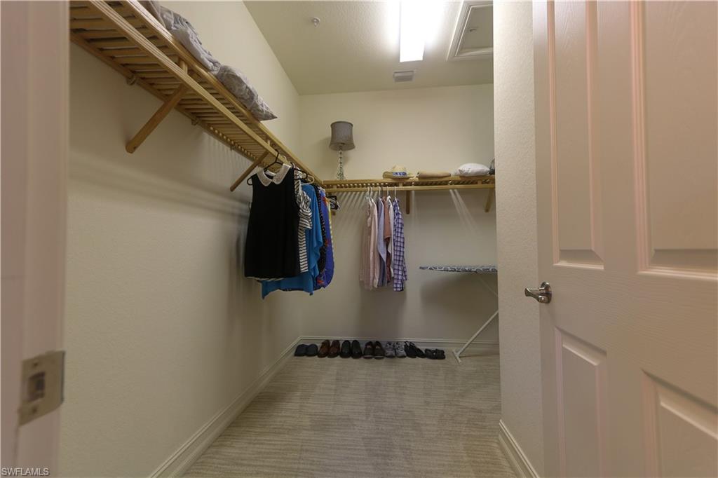 9114 Capistrano Street South, Unit 8501 Naples, FL 34113 - Photo 7 of 26 a view of walk in closet
