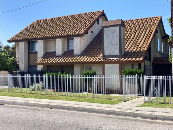 a view of a roof deck with wooden fence and floor