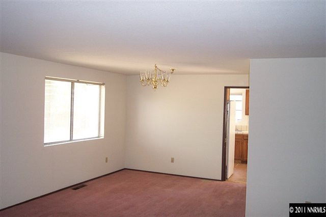 1515 Clough Road Reno, NV 89509 - Photo 3 of 13 an empty room with windows