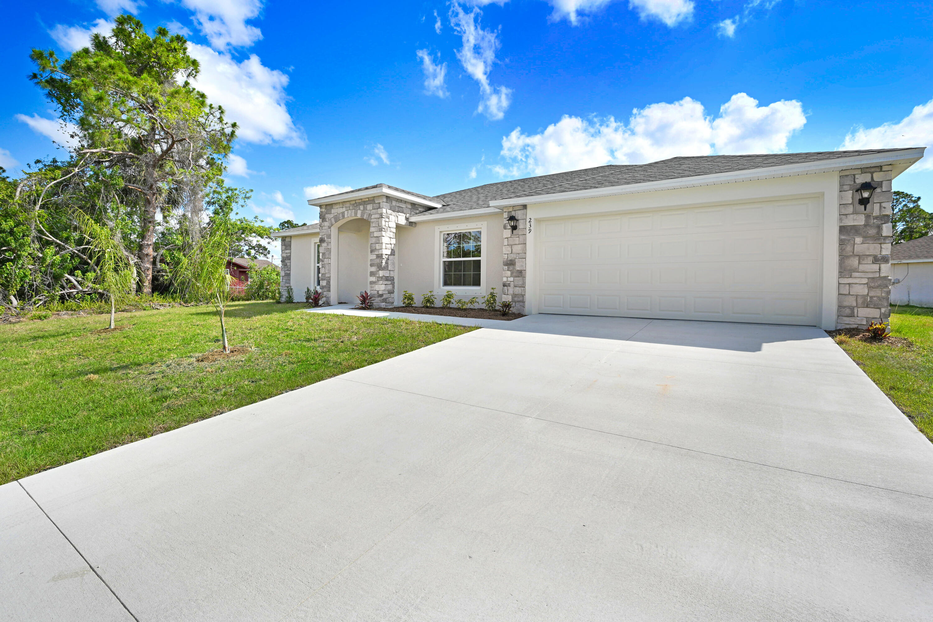 239 Trilby Road Southwest Palm Bay, FL 32908 - Photo 2 of 38 a view of a house with a patio