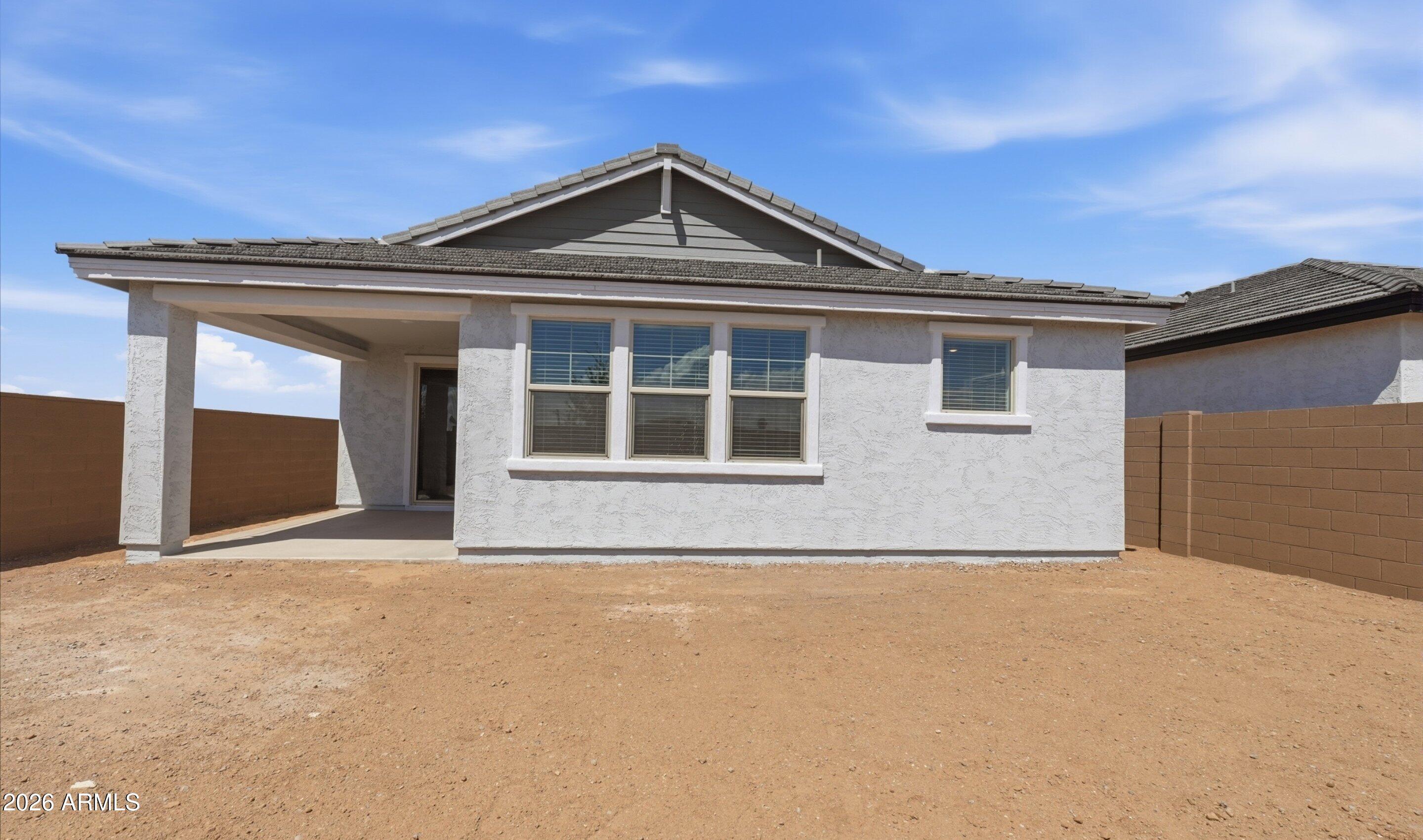 7779 West Sands Road Glendale, AZ 85303 - Photo 29 of 37 a front view of a house with a yard