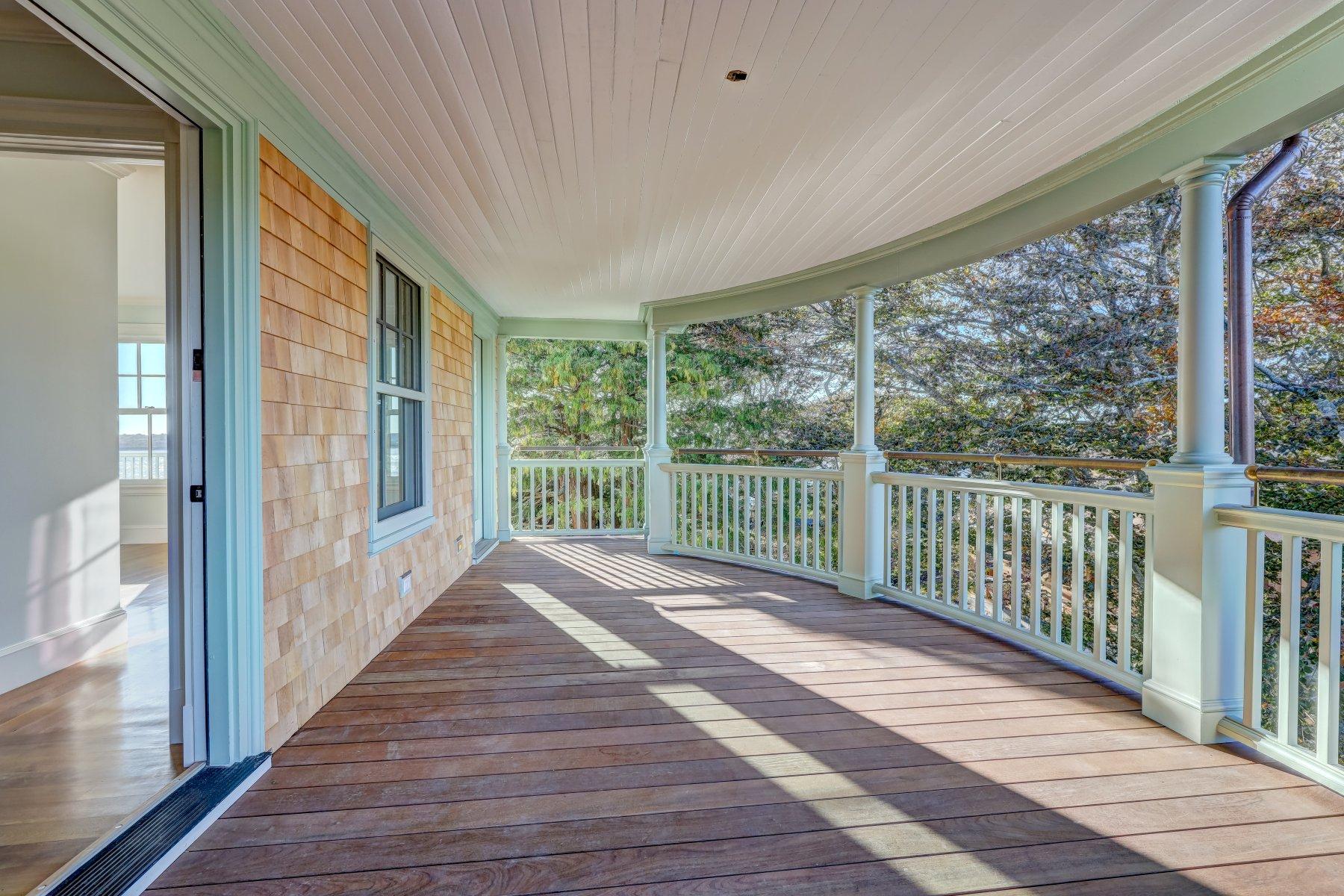 39 Juniper Point Road Woods Hole, MA 02543 - Photo 14 of 53 a view of a room with wooden floor and windows