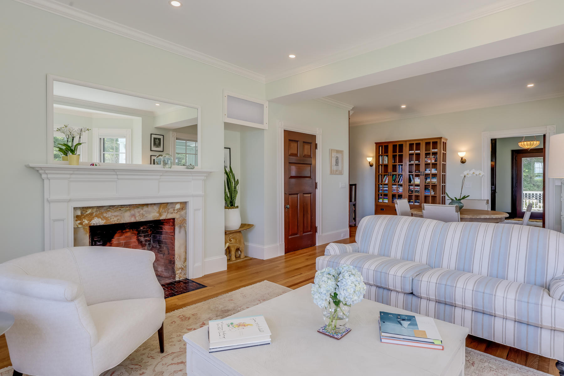 39 Juniper Point Road Woods Hole, MA 02543 - Photo 17 of 53 a living room with furniture and a fireplace