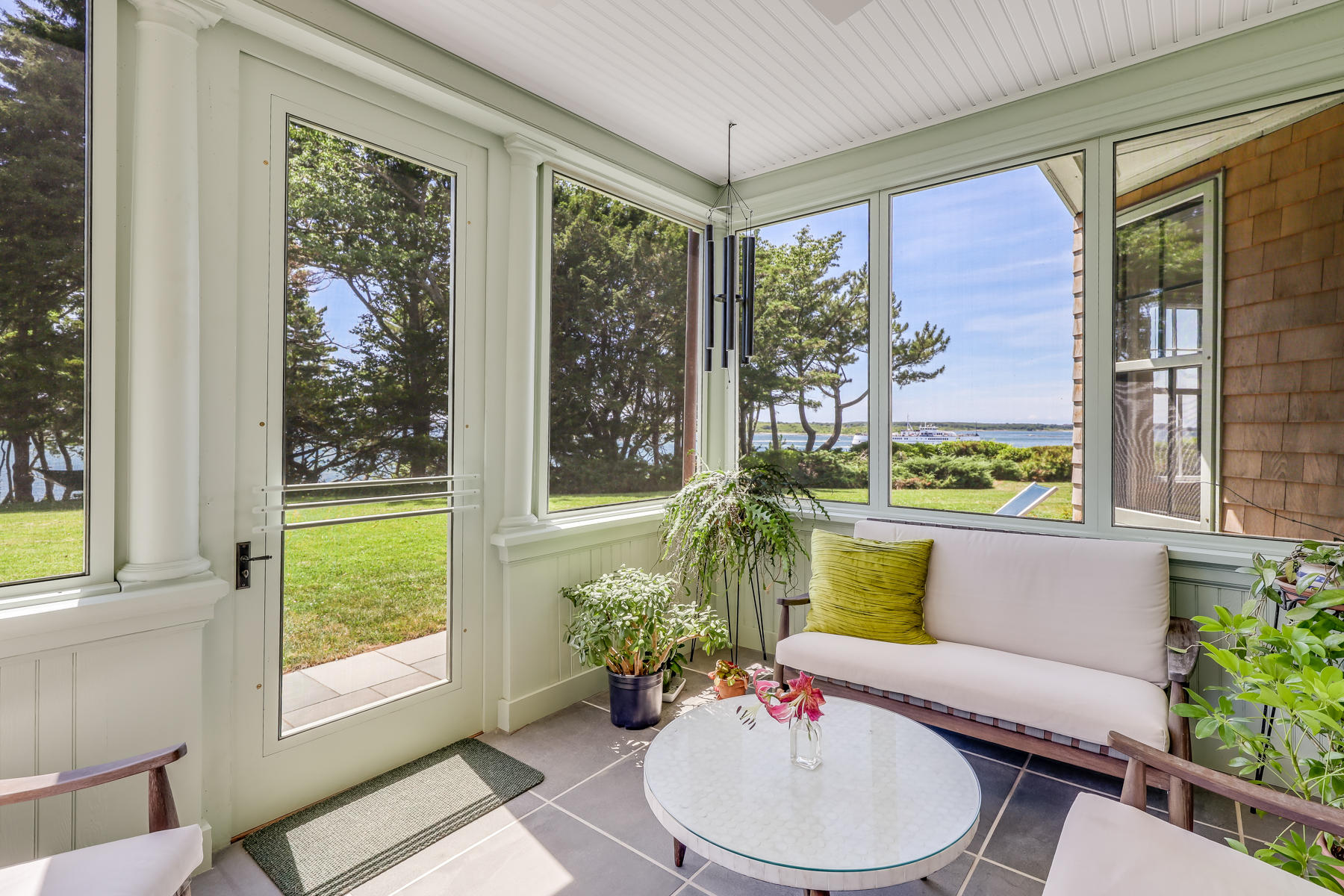 39 Juniper Point Road Woods Hole, MA 02543 - Photo 18 of 53 a living room with furniture and a large window
