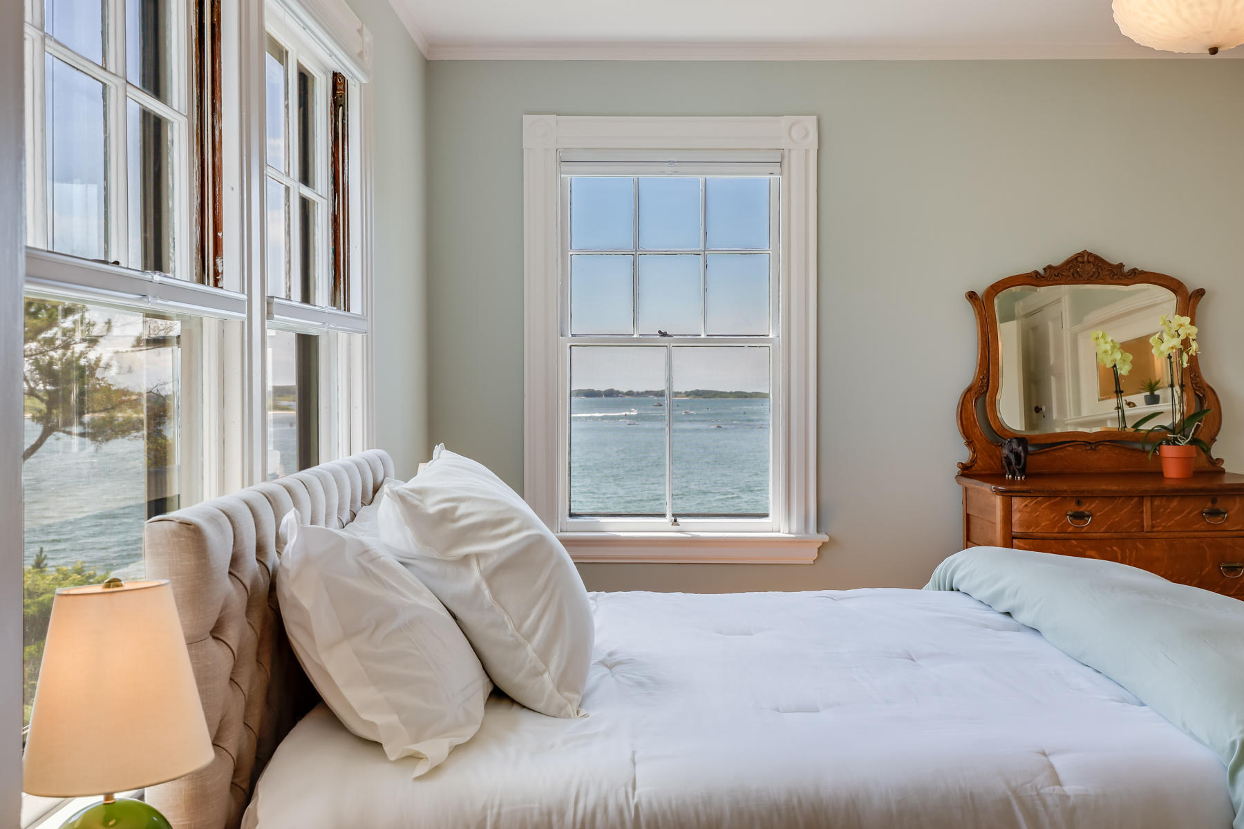39 Juniper Point Road Woods Hole, MA 02543 - Photo 30 of 53 a bedroom with a bed and wooden floor