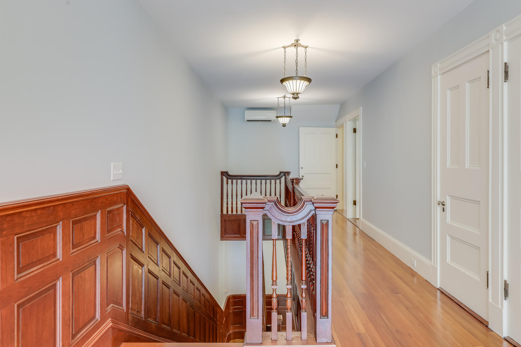 39 Juniper Point Road Woods Hole, MA 02543 - Photo 32 of 53 a view of a hallway with wooden floor and staircase
