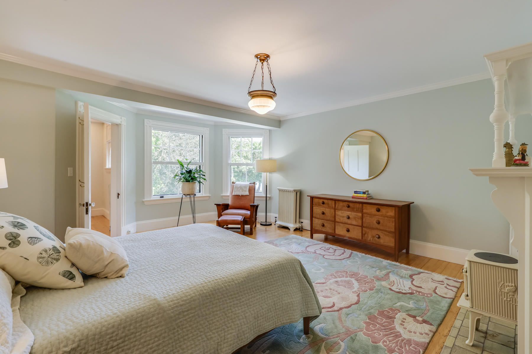 39 Juniper Point Road Woods Hole, MA 02543 - Photo 33 of 53 a bedroom with a bed large mirror and a window