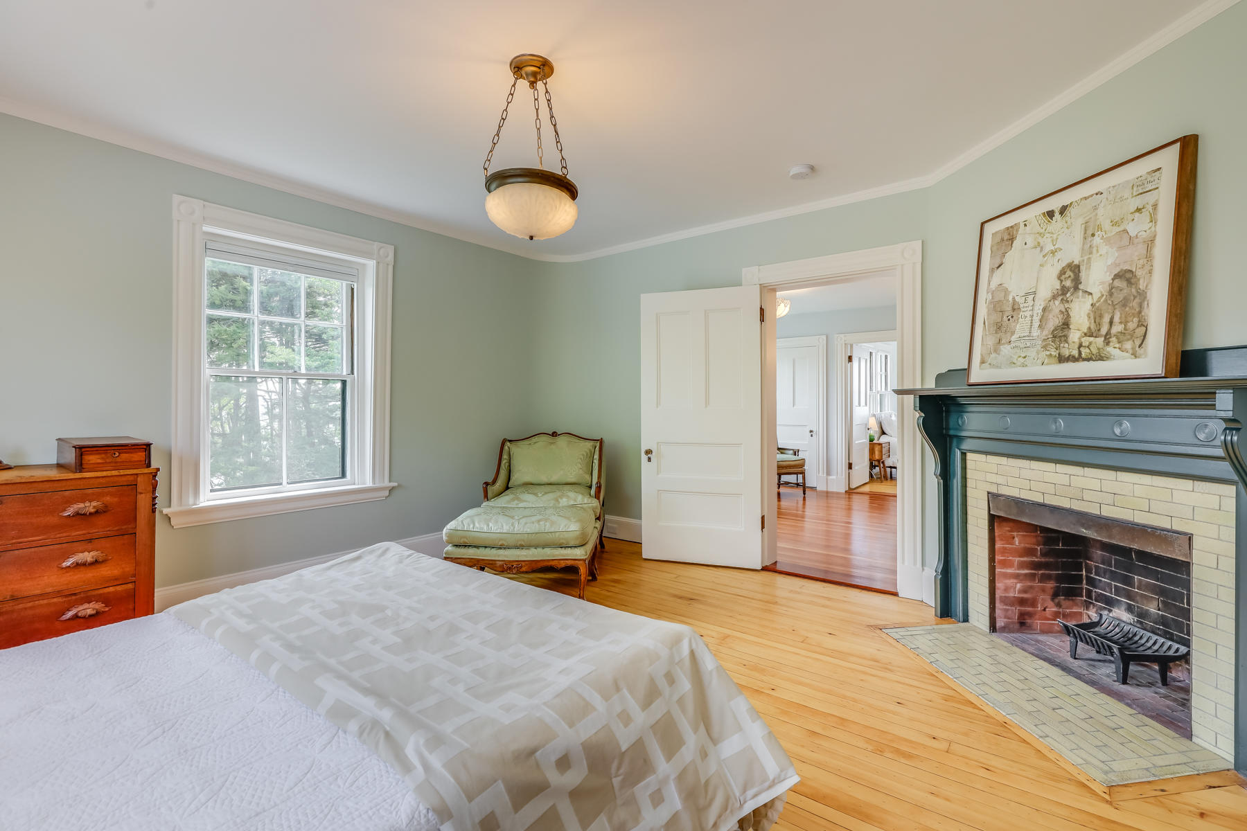 39 Juniper Point Road Woods Hole, MA 02543 - Photo 37 of 53 a bedroom with a bed and a fireplace