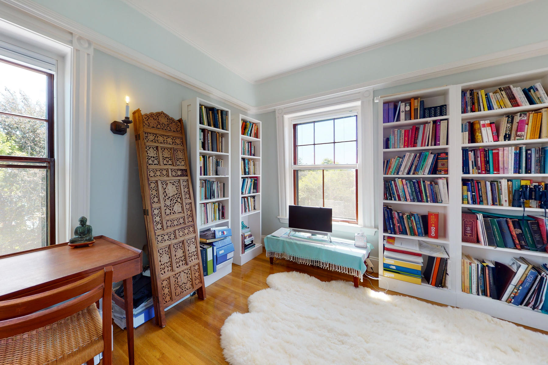 39 Juniper Point Road Woods Hole, MA 02543 - Photo 39 of 53 a living room with furniture and a book shelf