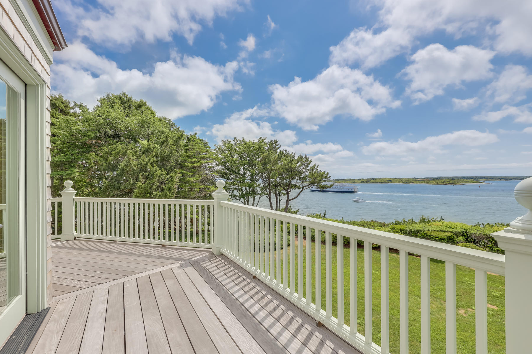 39 Juniper Point Road Woods Hole, MA 02543 - Photo 49 of 53 a balcony with wooden floor and fence