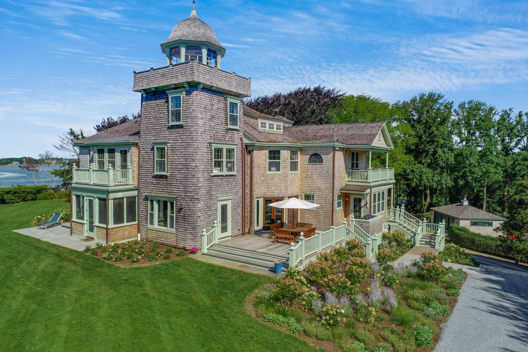 39 Juniper Point Road Woods Hole, MA 02543 - Photo 5 of 53 a front view of a house with a garden