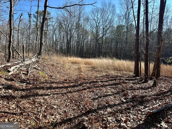 a view of wooden fence of a house