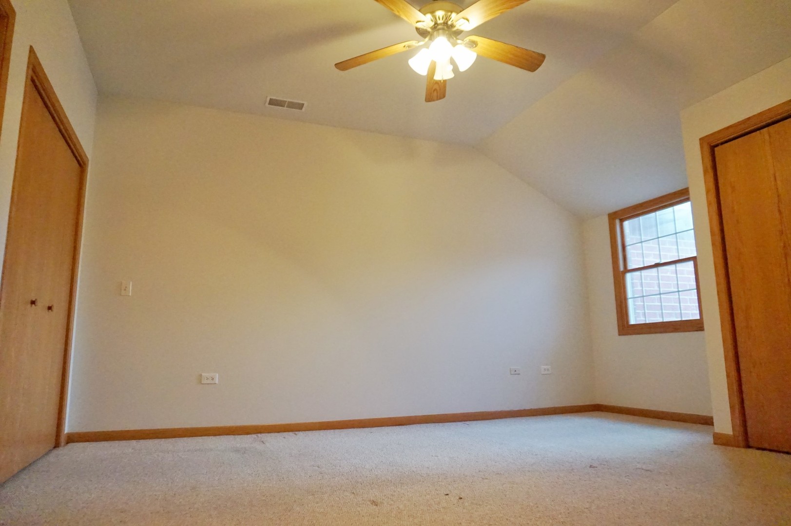Undisclosed Address Wilmington, IL 60481 - Photo 14 of 18 an empty room with windows and chandelier fan