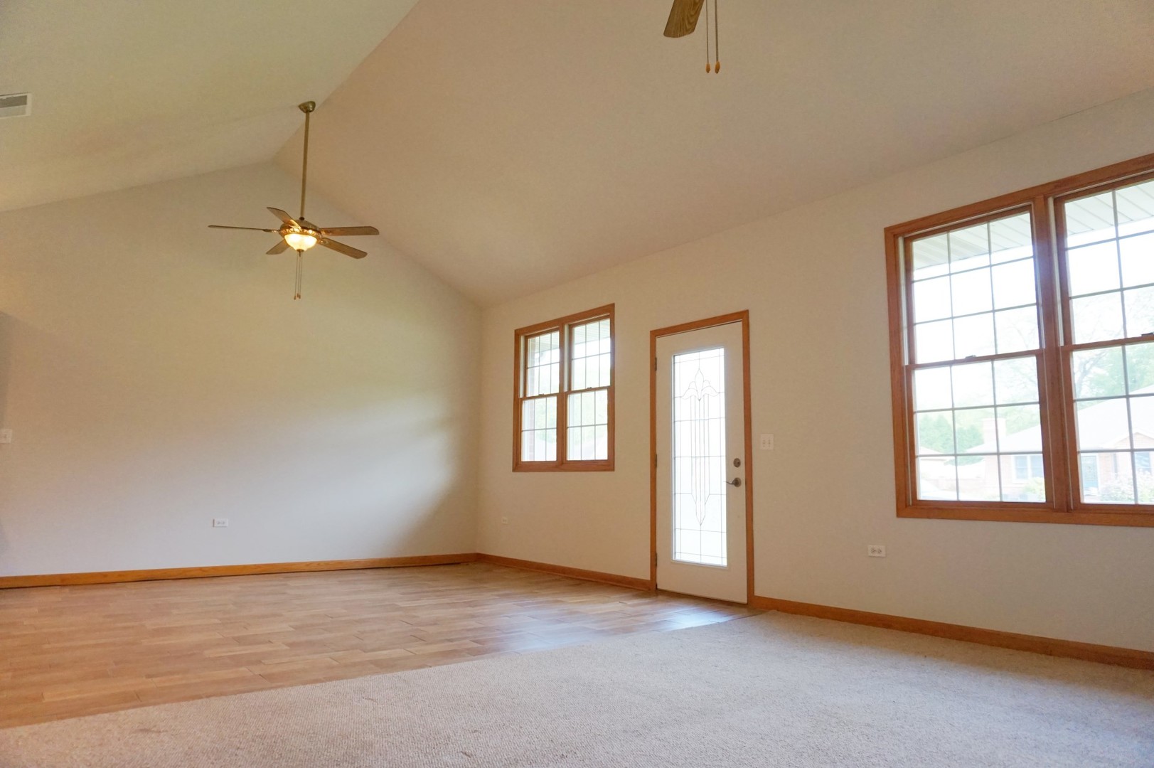 Undisclosed Address Wilmington, IL 60481 - Photo 2 of 18 an empty room with windows and ceiling fan
