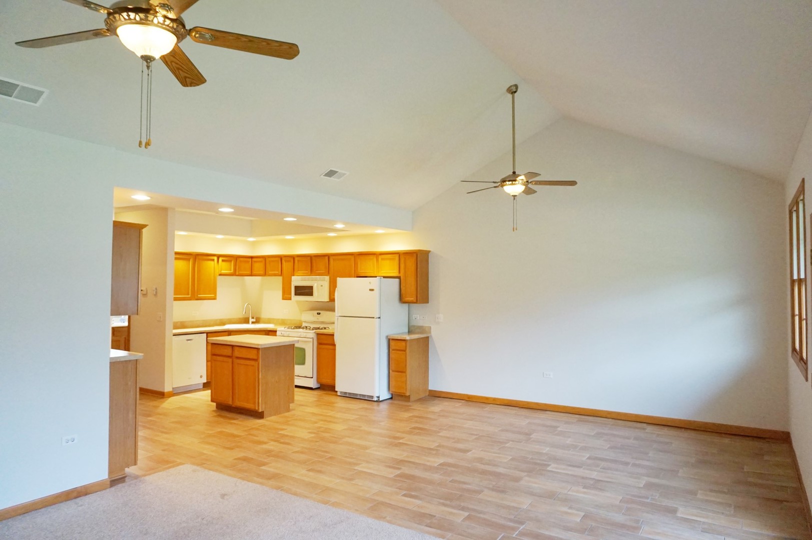 Undisclosed Address Wilmington, IL 60481 - Photo 5 of 18 a view of a livingroom with a chandelier furniture and a ceiling fan