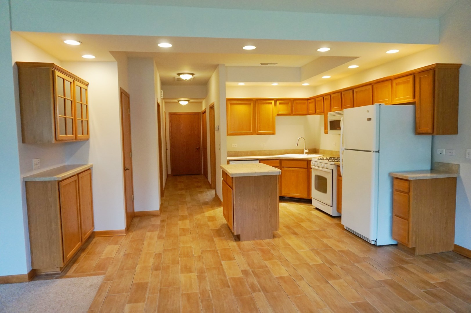 Undisclosed Address Wilmington, IL 60481 - Photo 6 of 18 a kitchen with stainless steel appliances a refrigerator and a stove top oven