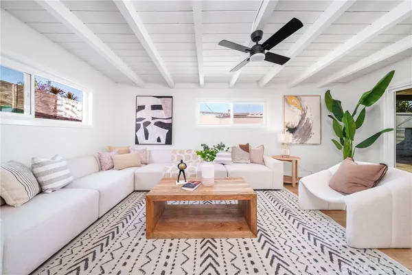 a living room with furniture and a rug