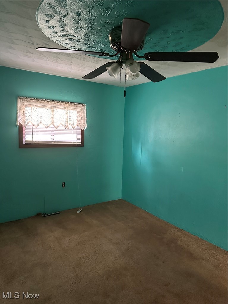 44952 Moose Ridge Road Woodsfield, OH 43793 - Photo 38 of 48 Bedroom featuring a ceiling fan & carpet
