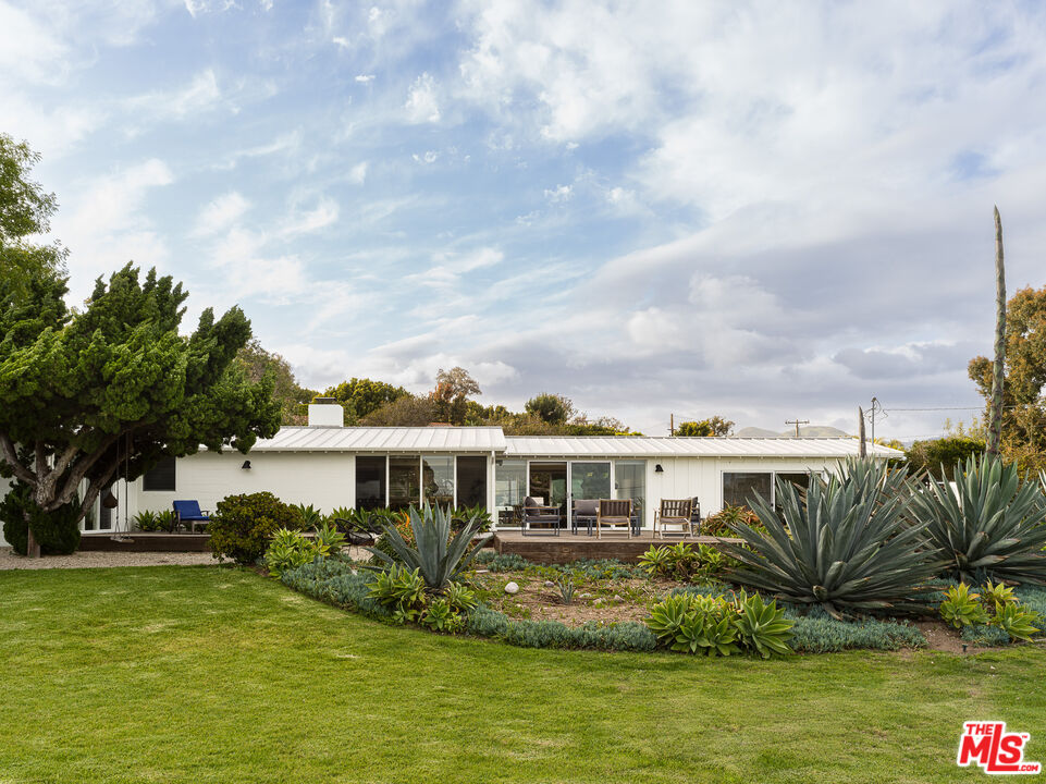 a view of a swimming pool with a garden
