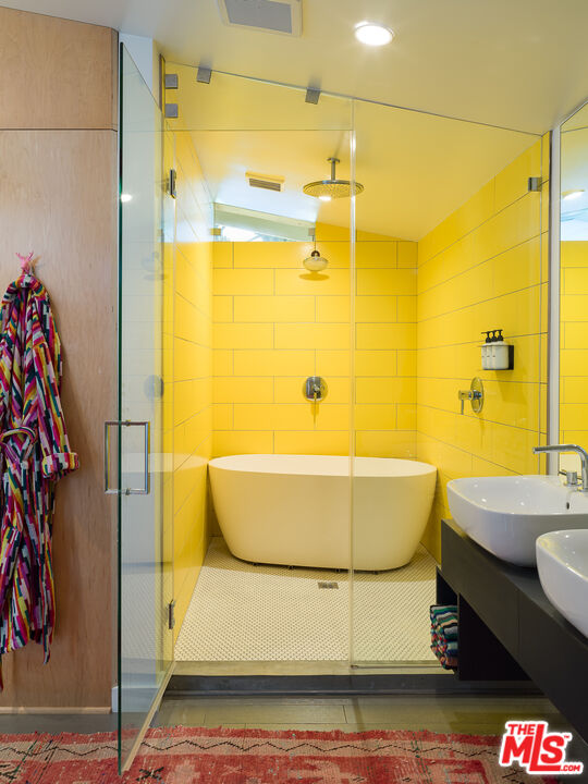 29107 Cliffside Drive Malibu, CA 90265 - Photo 12 of 22 a bathroom with a bathtub and a shower