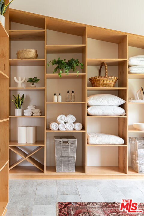 29107 Cliffside Drive Malibu, CA 90265 - Photo 16 of 22 a room with wooden floor and shoes