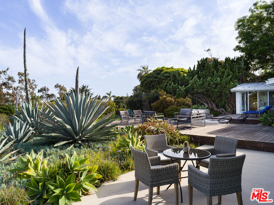 29107 Cliffside Drive Malibu, CA 90265 - Photo 17 of 22 a view of a backyard with sitting area