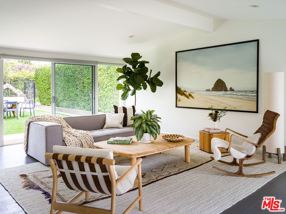 29107 Cliffside Drive Malibu, CA 90265 - Photo 2 of 22 a living room with furniture and a large window with wooden floor