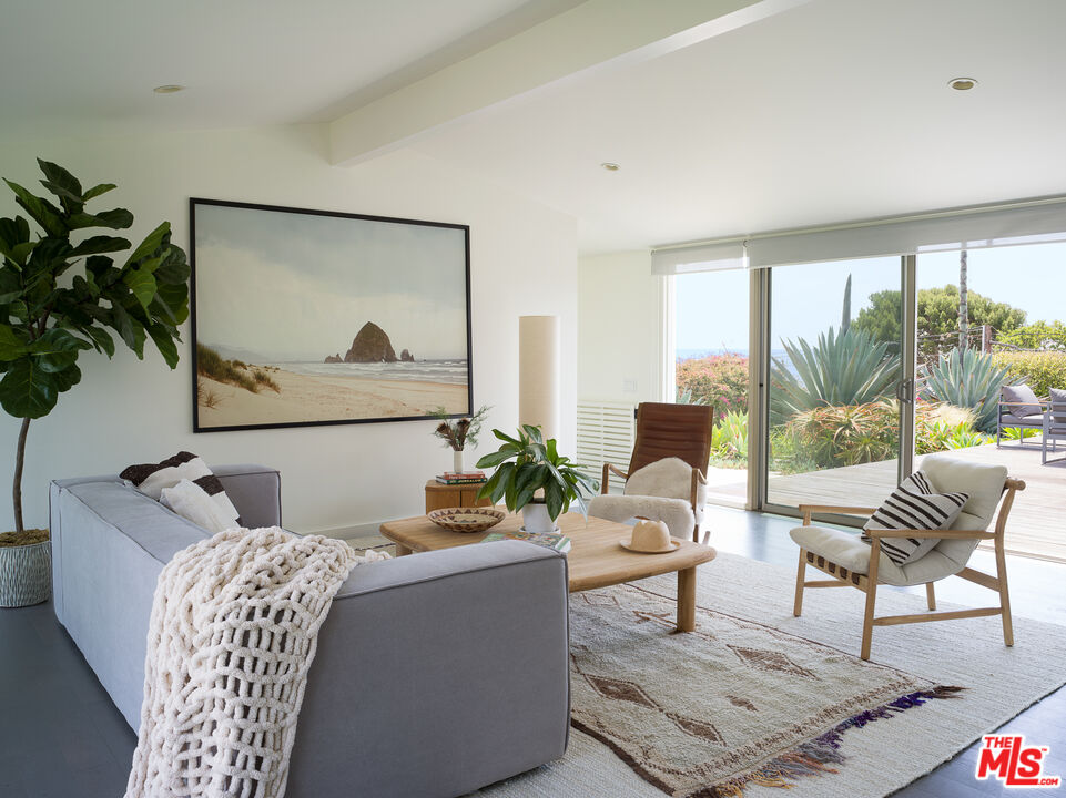 29107 Cliffside Drive Malibu, CA 90265 - Photo 3 of 22 a living room with furniture and a large window
