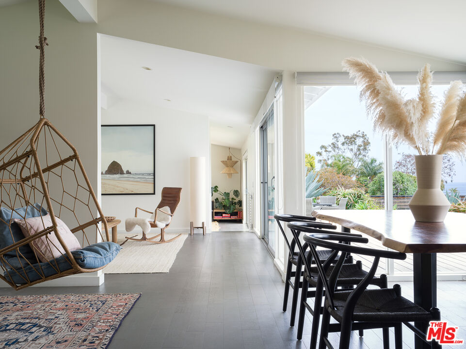 29107 Cliffside Drive Malibu, CA 90265 - Photo 7 of 22 a view of a dining room with furniture window and outside view