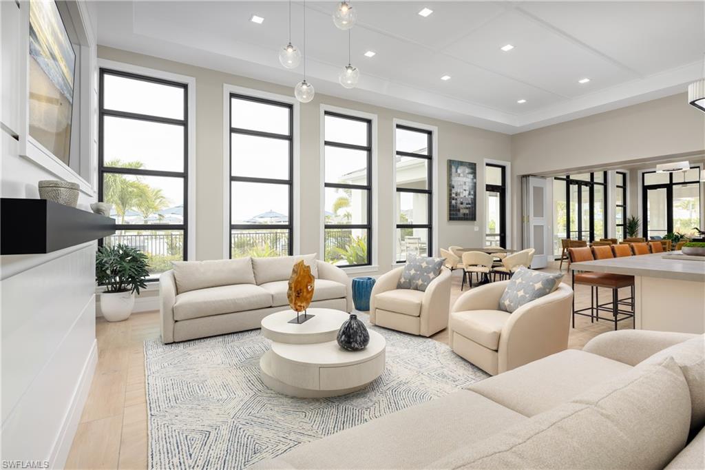 9057 Wisteria Way Naples, FL 34114 - Photo 11 of 25 a living room with furniture and a large window