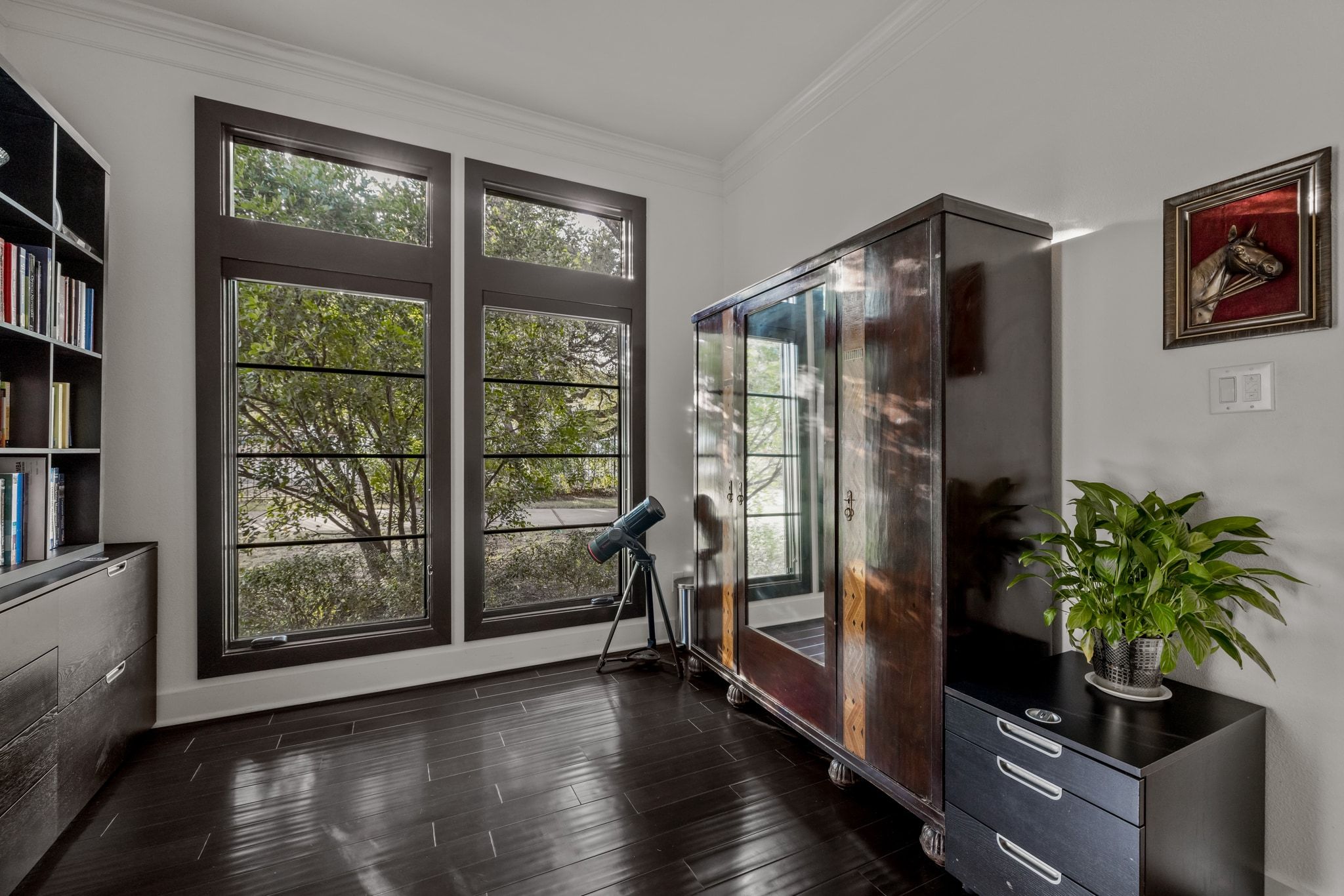 4720 Rockcliff Road, Unit 1 Austin, TX 78746 - Photo 27 of 39 Rich hardwood floors complement large windows in this versatile study.