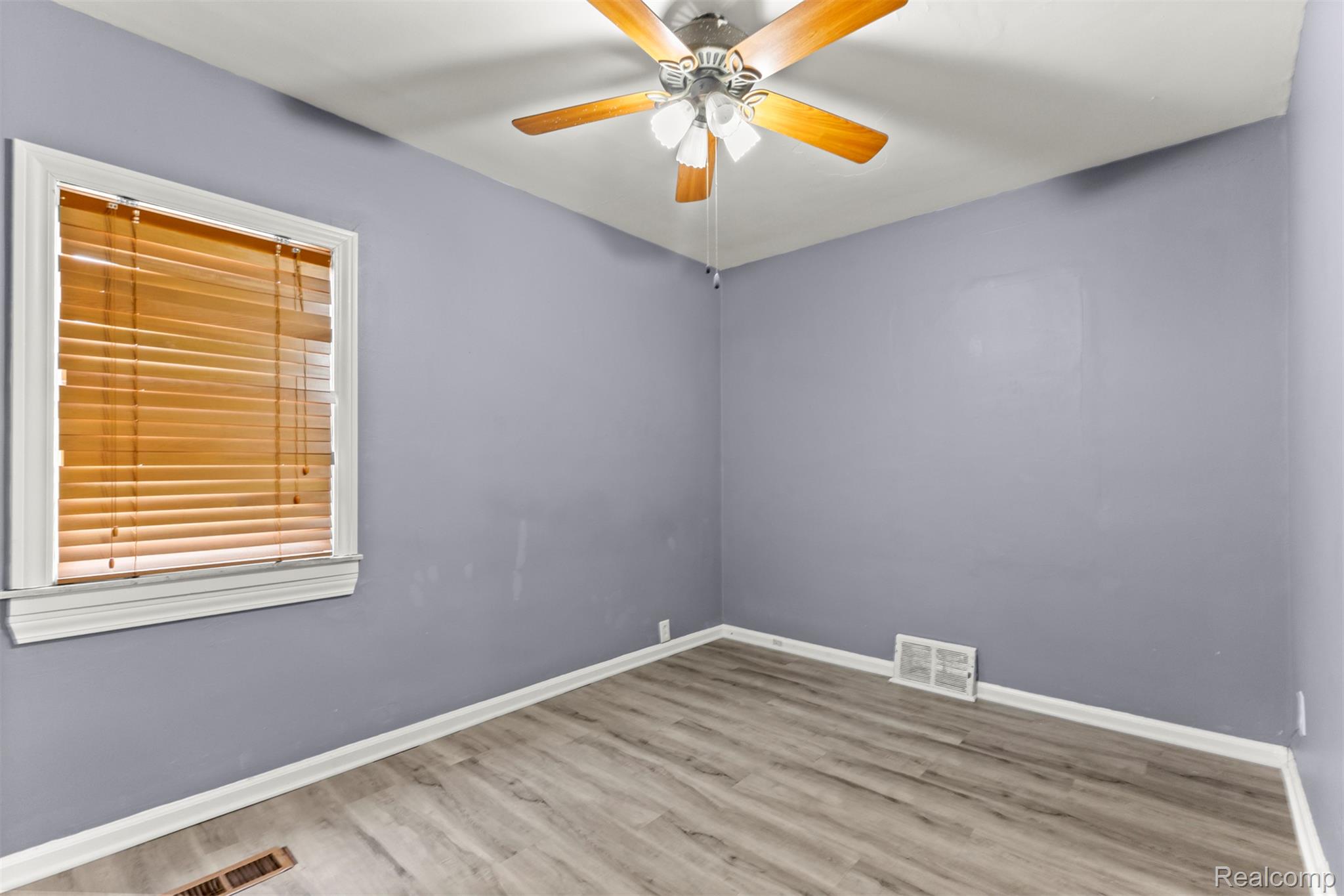 14716 Eureka Road Southgate, MI 48195 - Photo 20 of 42 Spare room featuring ceiling fan and light wood finished floors