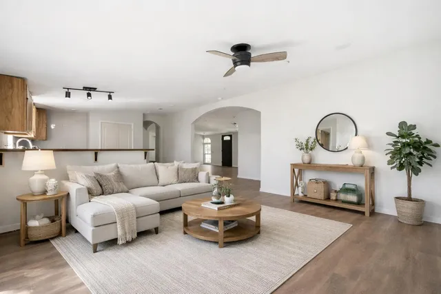 a living room with furniture and a fireplace