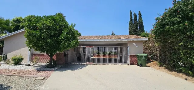 a view of front door of house with potted plant