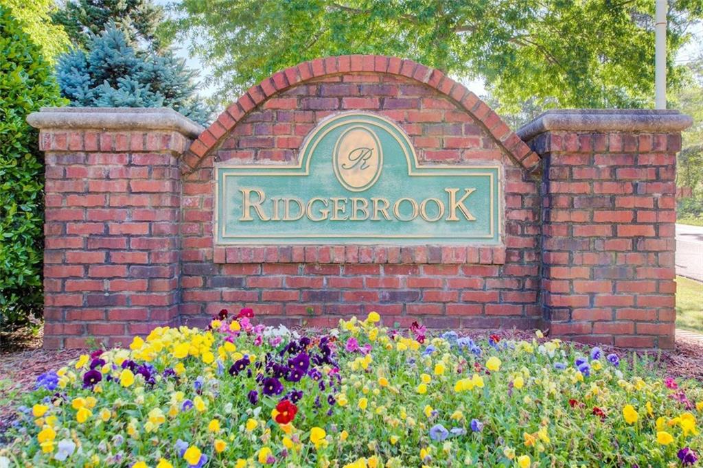 4110 Ridgebrook Bend Cumming, GA 30028 - Photo 49 of 49 a sign that is sitting in front of flowers