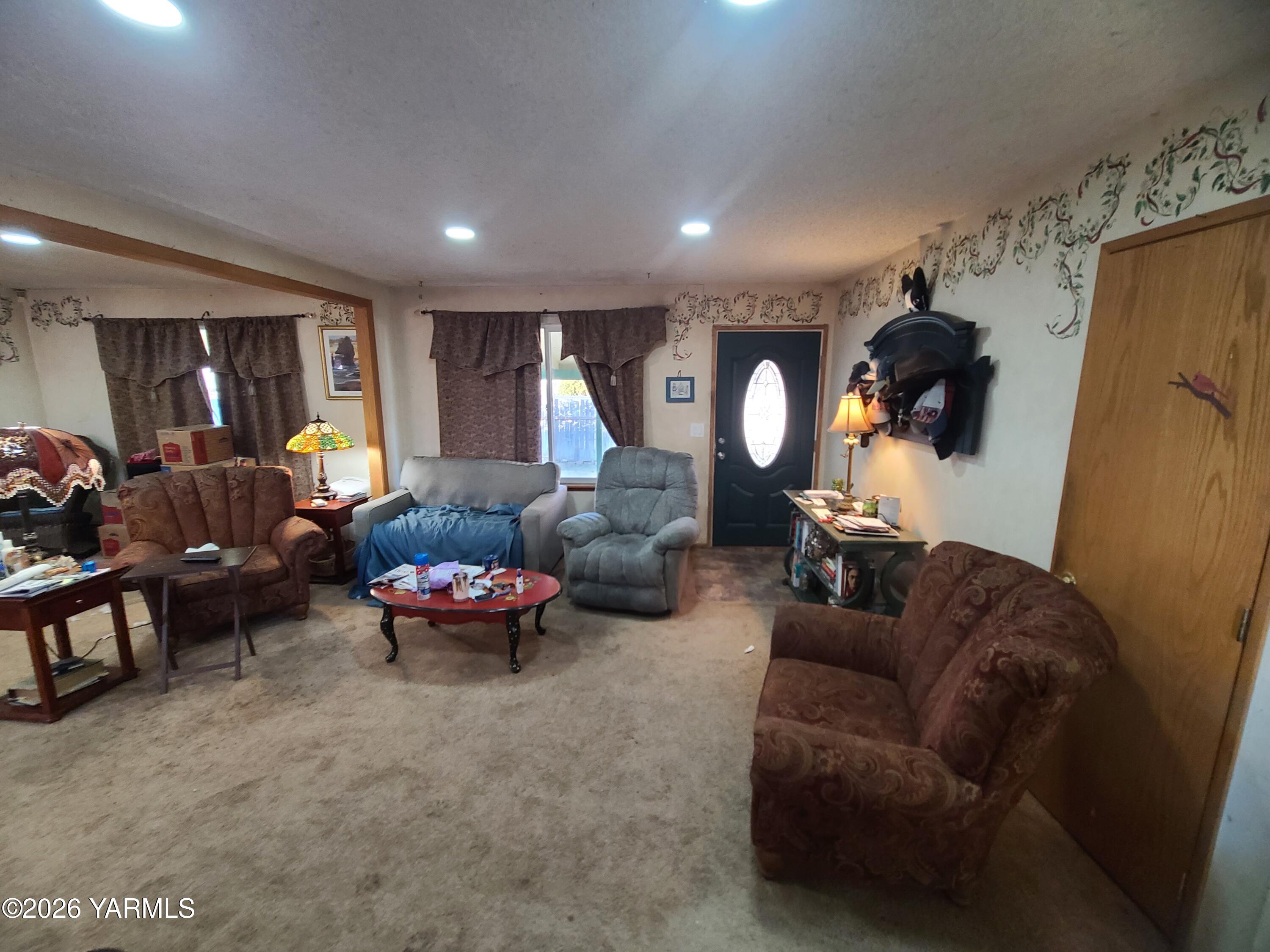 10608 Hackett Road Yakima, WA 98903 - Photo 6 of 25 a living room with furniture and a large window