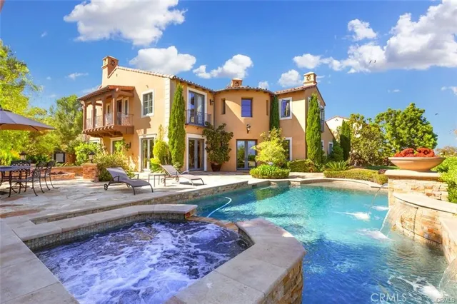 an aerial view of residential houses with outdoor space and street view
