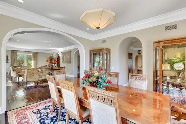 a view of walk in closet with clothes