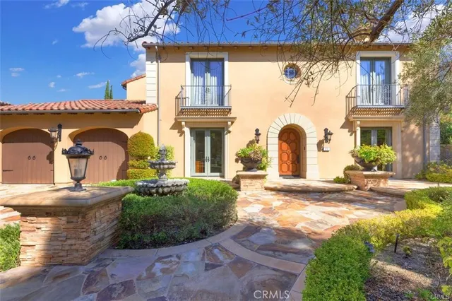 a view of a fountain sitting in the middle of a garden