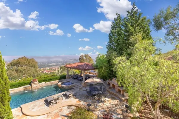 a view of a garden with a building in the background