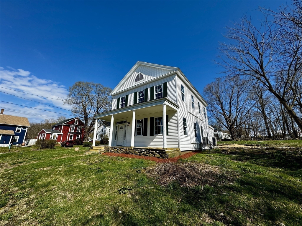 11 Main Street Brookfield, MA 01506 - Photo 1 of 29 a front view of a house with a garden