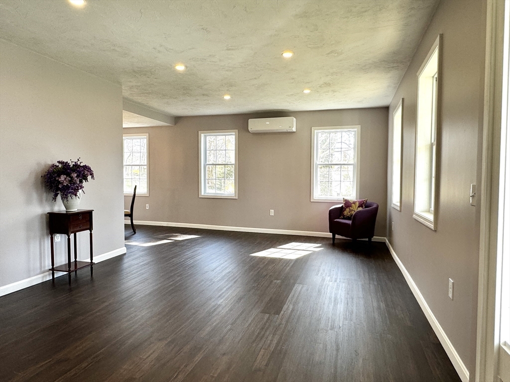 11 Main Street Brookfield, MA 01506 - Photo 14 of 29 a view of an empty room window and wooden floor