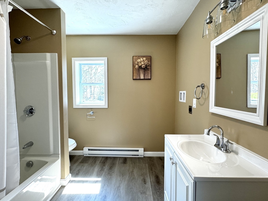 11 Main Street Brookfield, MA 01506 - Photo 15 of 29 a bathroom with a sink a toilet and shower