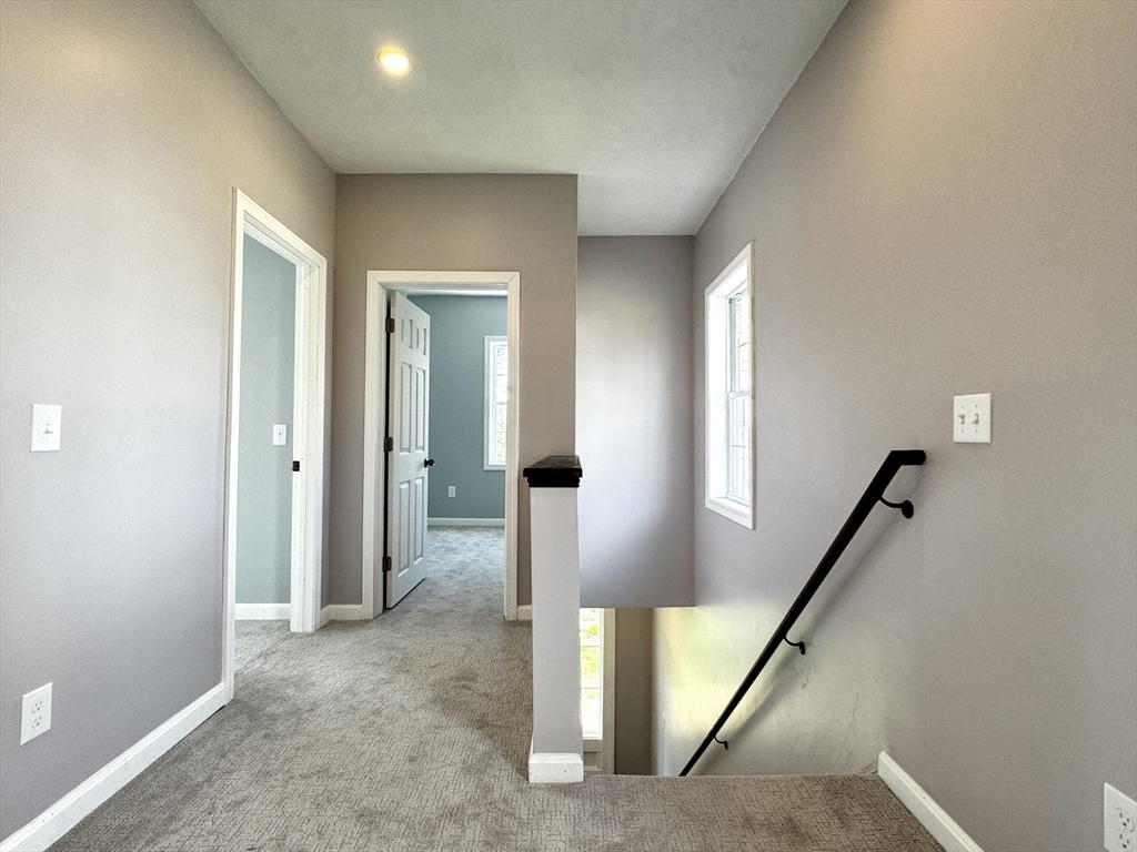 11 Main Street Brookfield, MA 01506 - Photo 17 of 29 wooden floor with windows and stairs