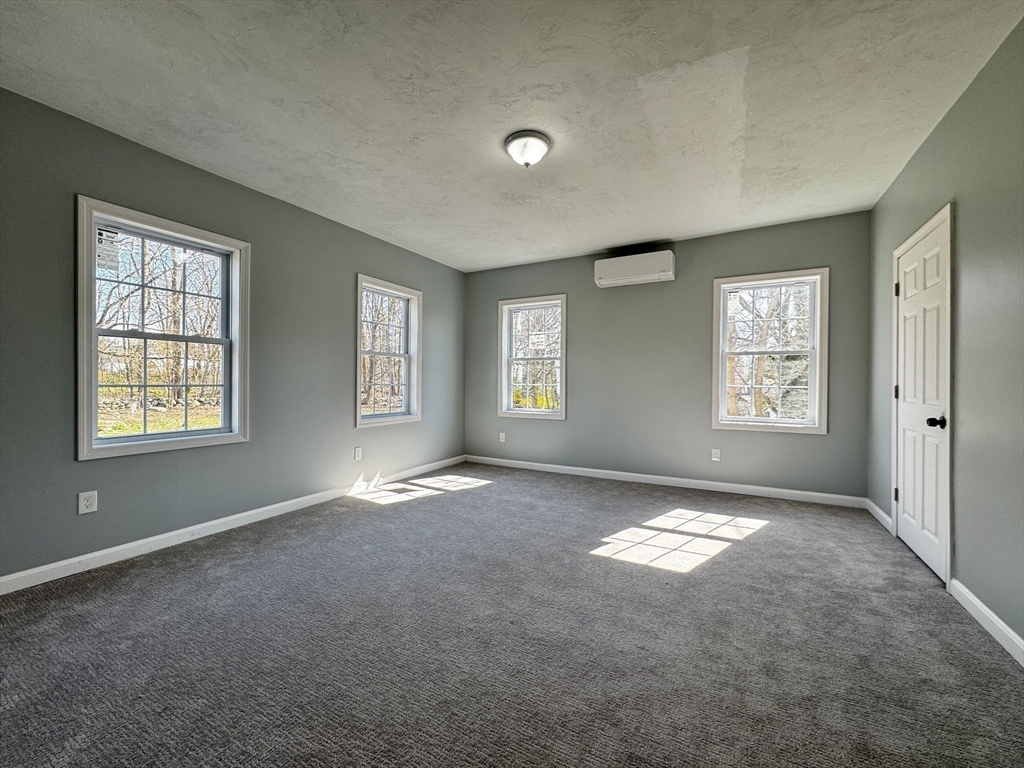 11 Main Street Brookfield, MA 01506 - Photo 18 of 29 an empty room with windows and closet